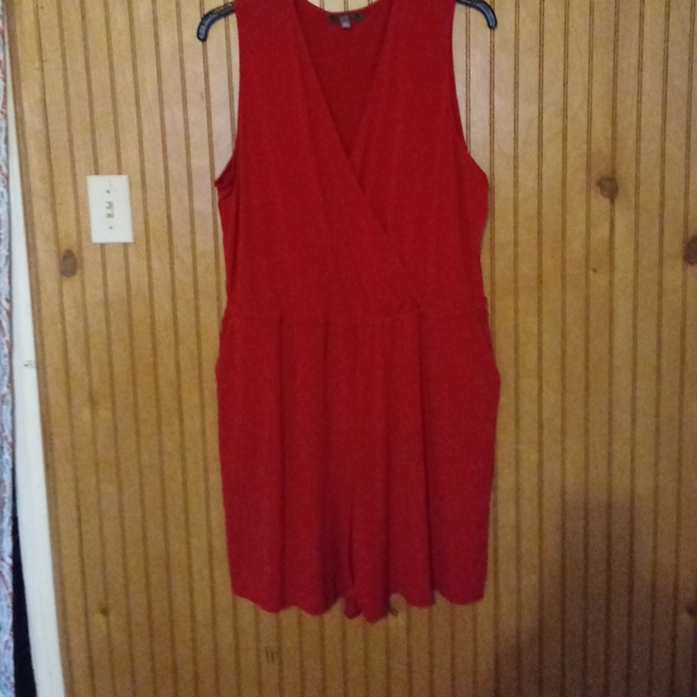 A red romper with pockets